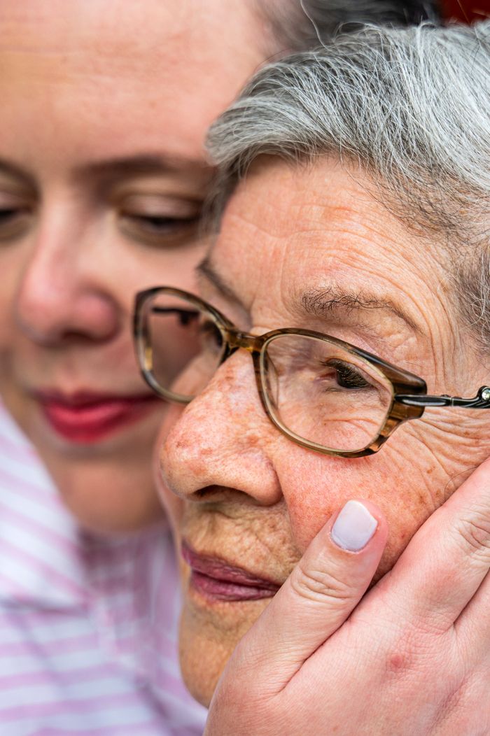 Close portrait of a caring bond between a woman and senior woman.
